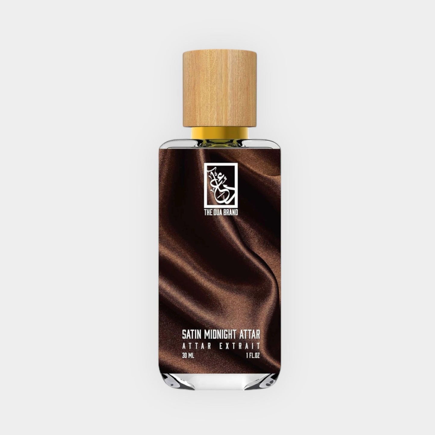 Samplefles van Dua Satin Midnight Attar, met een elegante houten dop en een verfijnde bruine verpakking die de fraaie geur benadrukt.