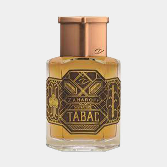 A small bottle of Zaharoff Signature Tabac Sample, featuring an ornate, gold and black label with intricate designs and a copper-colored cap, containing a rich, amber liquid.