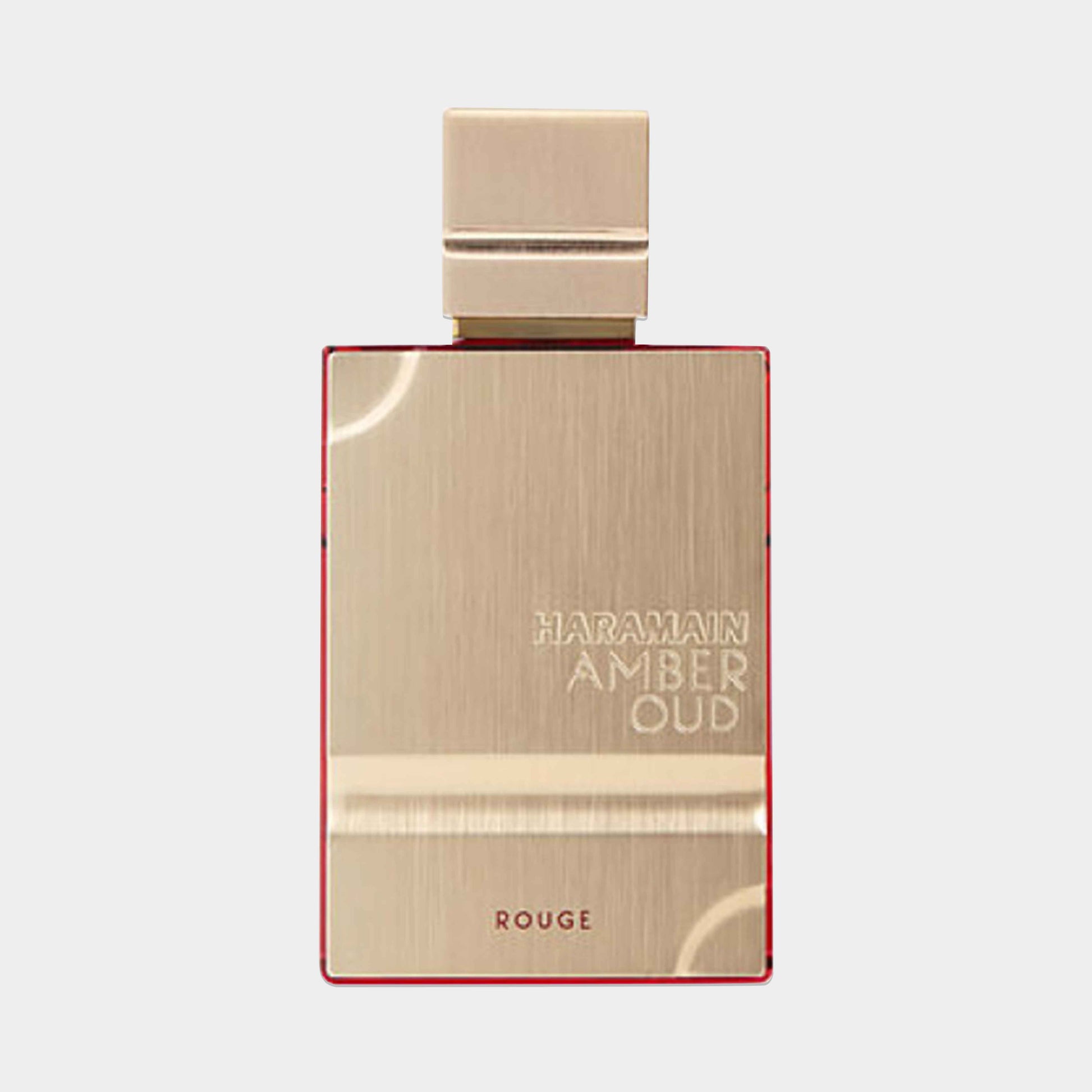 Al Haramain Amber Oud Rouge Sample is een luxe parfum in een elegant, gouden flacon met een opvallende rode rand, perfect voor liefhebbers van rijke geuren.
