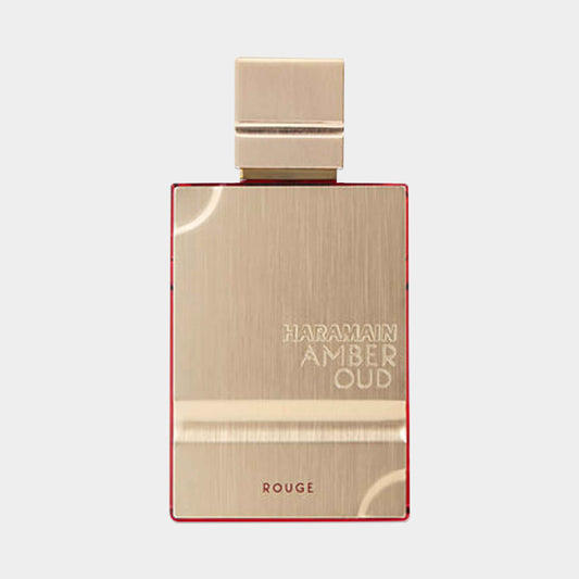 Al Haramain Amber Oud Rouge Sample is een luxe parfum in een elegant, gouden flacon met een opvallende rode rand, perfect voor liefhebbers van rijke geuren.