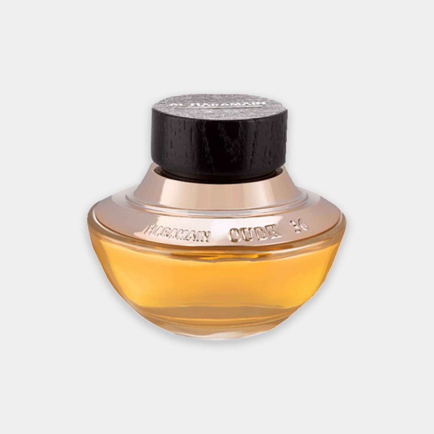 Al Haramain Oudh 36 Sample - een elegante geur in een ronde, gouden fles met een zwarte dop, perfect voor liefhebbers van luxe parfums.