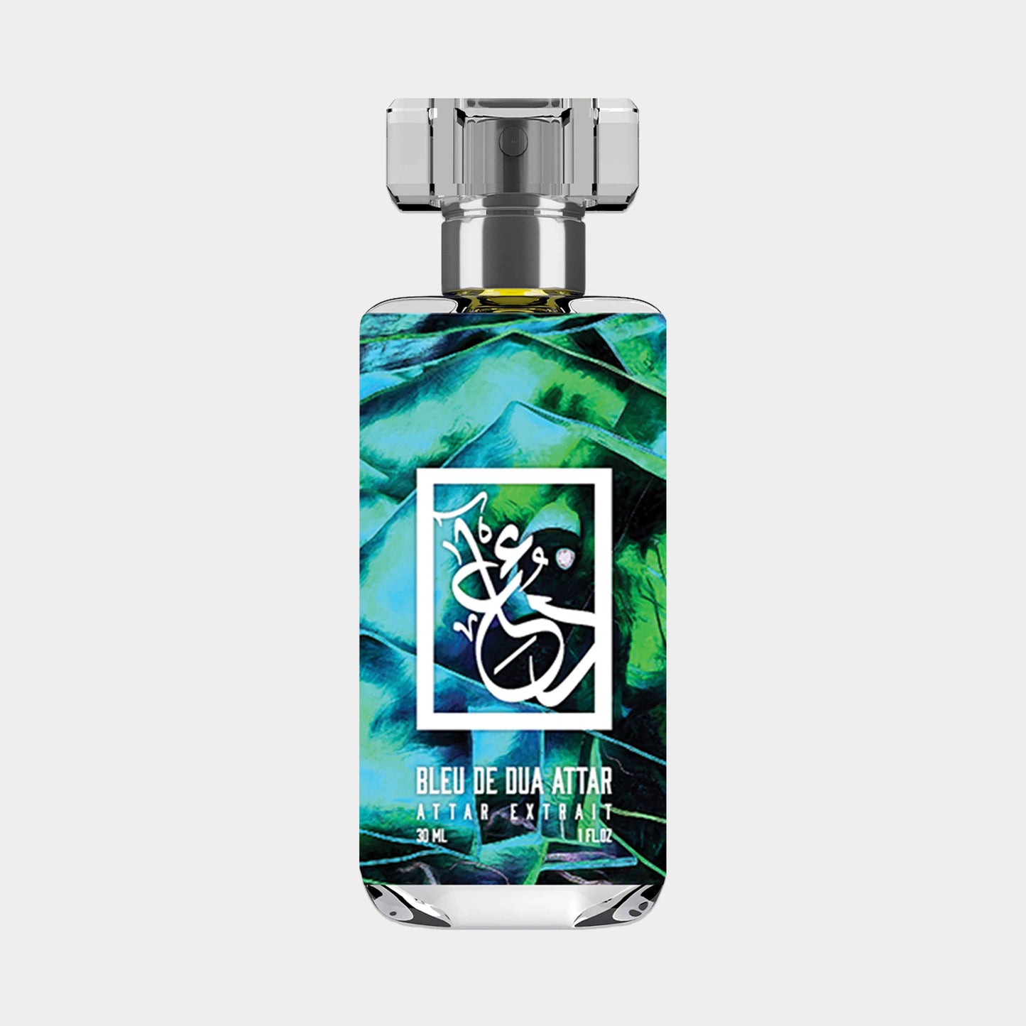 Samplefles van Dua Bleu de Dua Attar, een alcoholvrije geur in een elegante fles van 30 ml, versierd met een kleurrijk groen-blauw ontwerp.