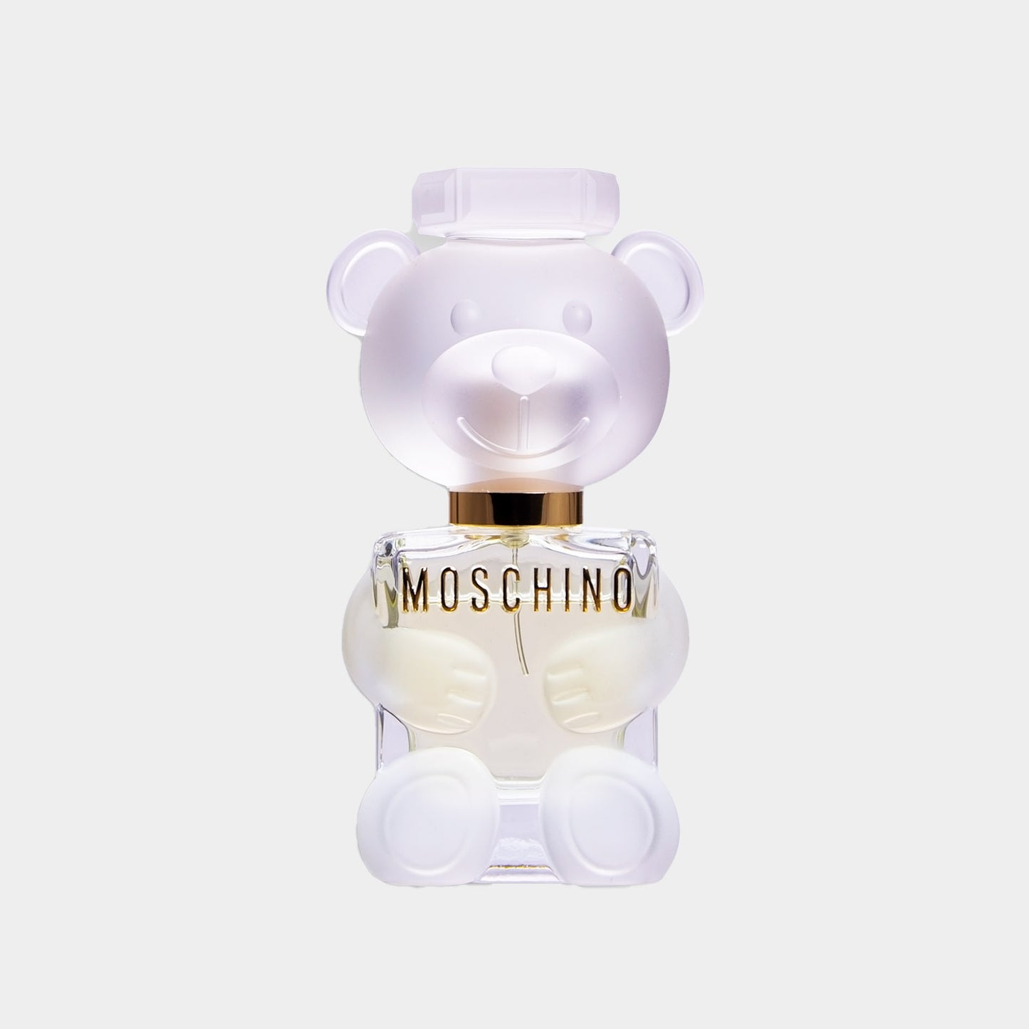 Moschino Toy 2 Sample, een unieke parfumfles in de vorm van een schattige, doorzichtige teddybeer met een gouden detail.