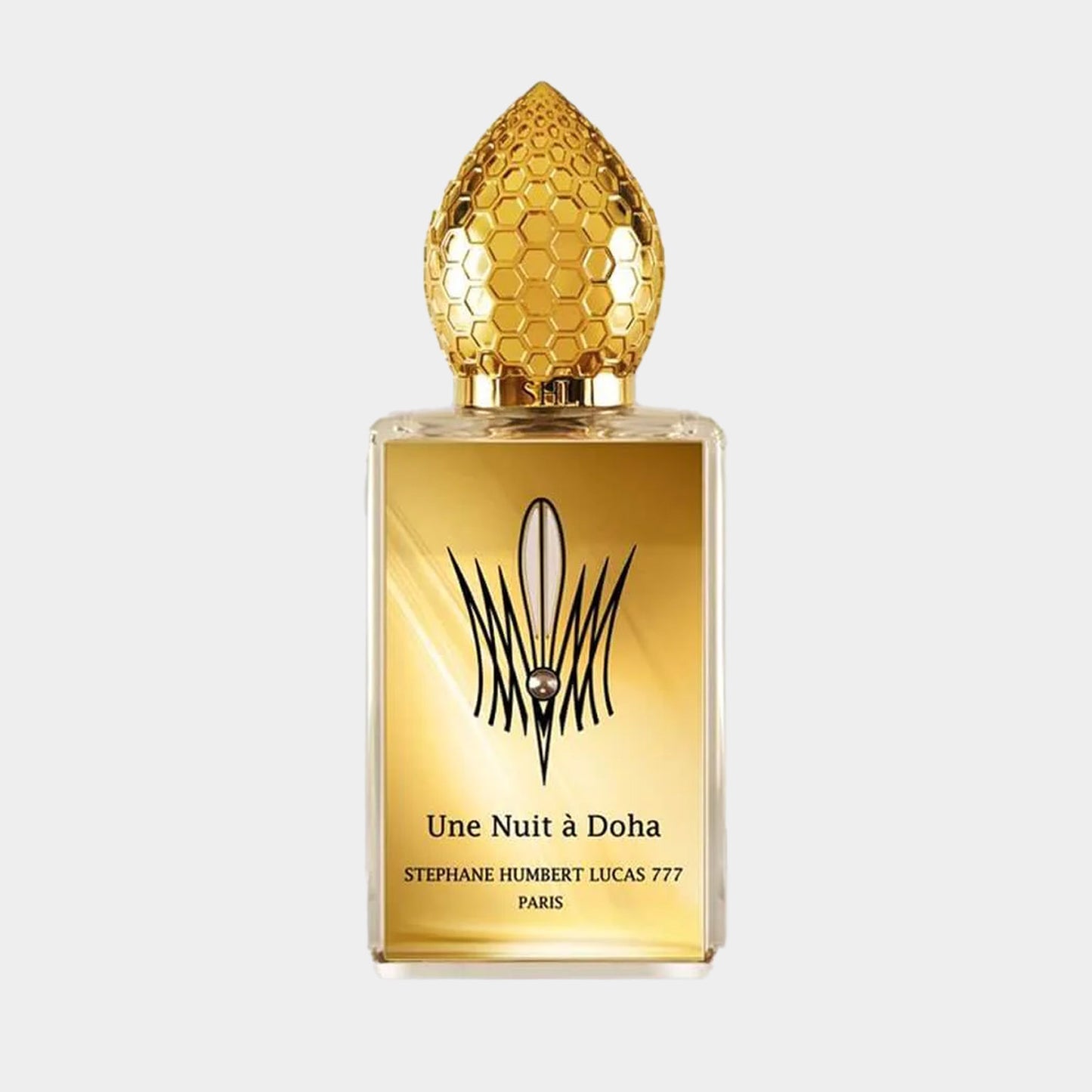Sample of Stephane Humbert Lucas Une Nuit à Doha, featuring an ornate golden bottle topped with a honeycomb-patterned cap, encapsulating a luxurious fragrance experience.