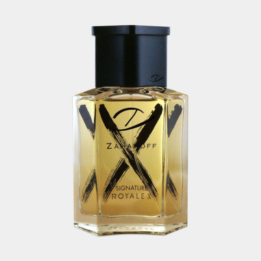 Een fles Zaharoff Signature Royale X Sample, elegant vormgegeven met een transparante puntige flacon en goudkleurige vloeistof, voorzien van een opvallend zwart logo en accentlijnen.