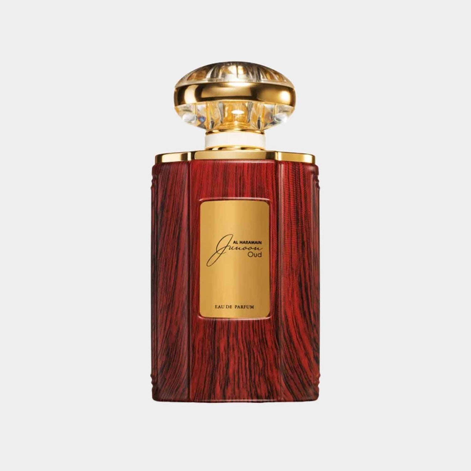 Volle fles Al Haramain Junoon Oud, verpakt in een luxe houten design met een gouden stopper, perfect voor liefhebbers van aparte parfums.