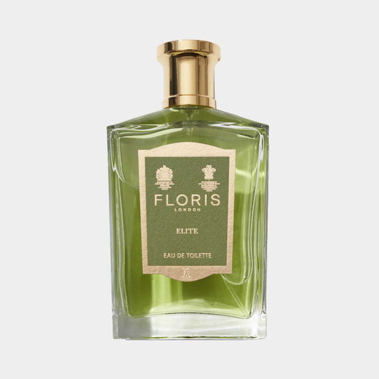 Een volle flacon Floris London Elite, een elegante eau de toilette met een groene tint en een verfijnd ontwerp. De flacon heeft een gouden dop en een label met de naam van het parfum.