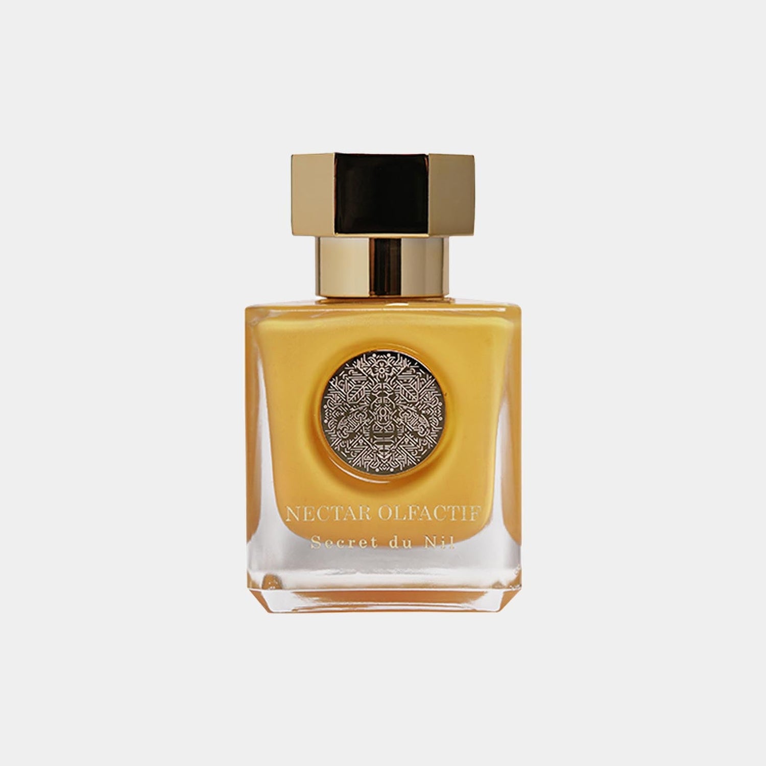 Full bottle van Nectar Olfactif Secret du Nil, met een gouden afwerking en een ornamentele dop, gepresenteerd op een lichte achtergrond.