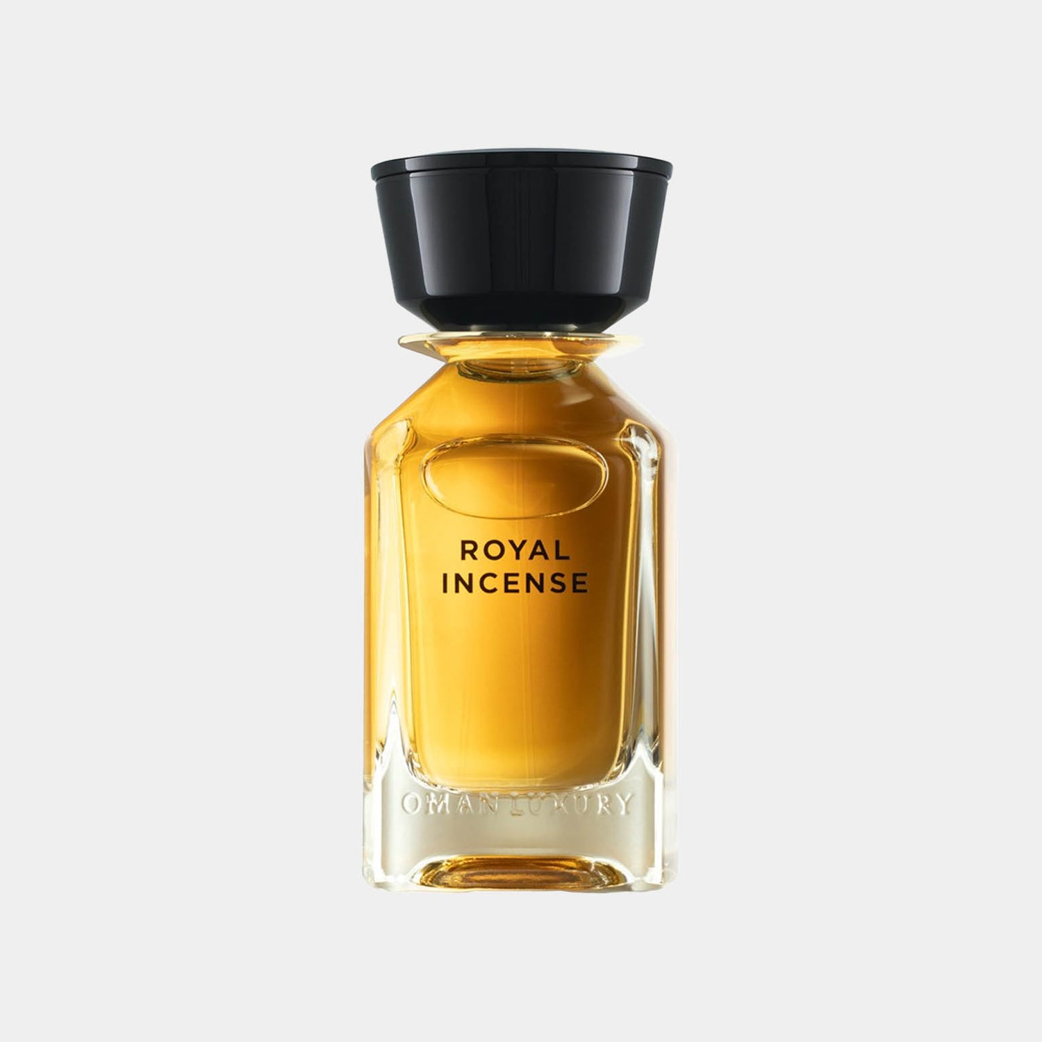 Omanluxury Royal Incense Sample, een elegante glazen fles met een gouden vloeistof en een zwarte dop, ontworpen voor een luxe geurervaring.